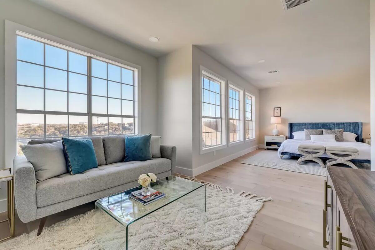 Serene Bedroom Suite Featuring a Cozy Seating Area by the Window