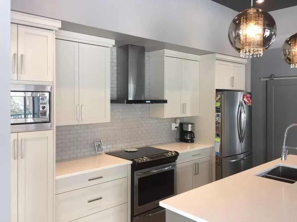 Wow, Take a Look at Those Dramatic Pendant Lights in This Modern Kitchen