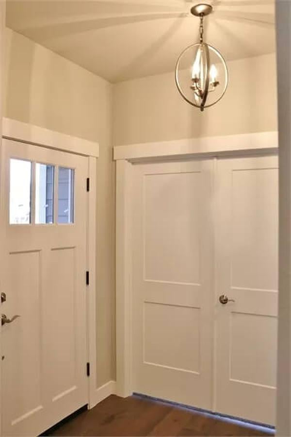 Bright Entryway Featuring a Sleek Chandelier