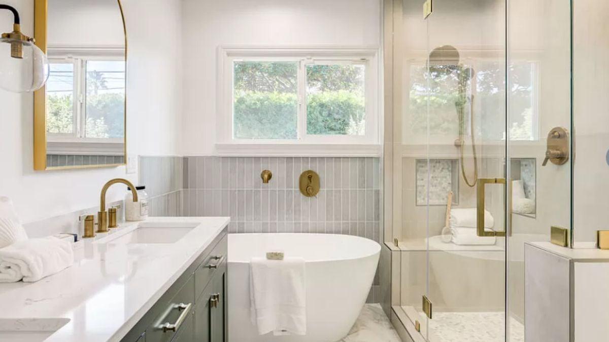 Freestanding Tub and Gold Accents Bring Luxe to This Bath Retreat