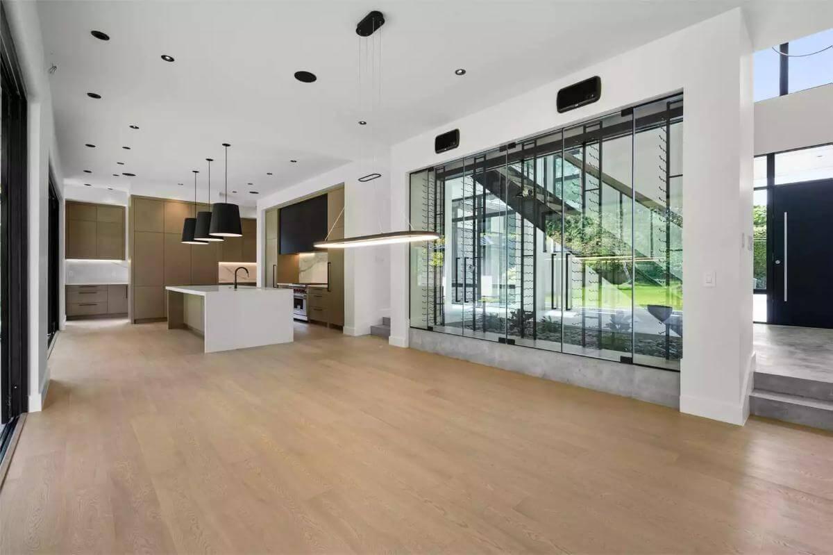 Wow, Look at That Expansive Wine Storage Beside the Sleek Kitchen