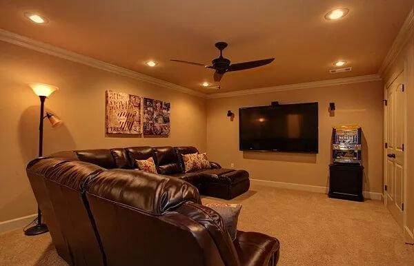 Cozy Media Room with Plush Leather Seating and Ambient Lighting