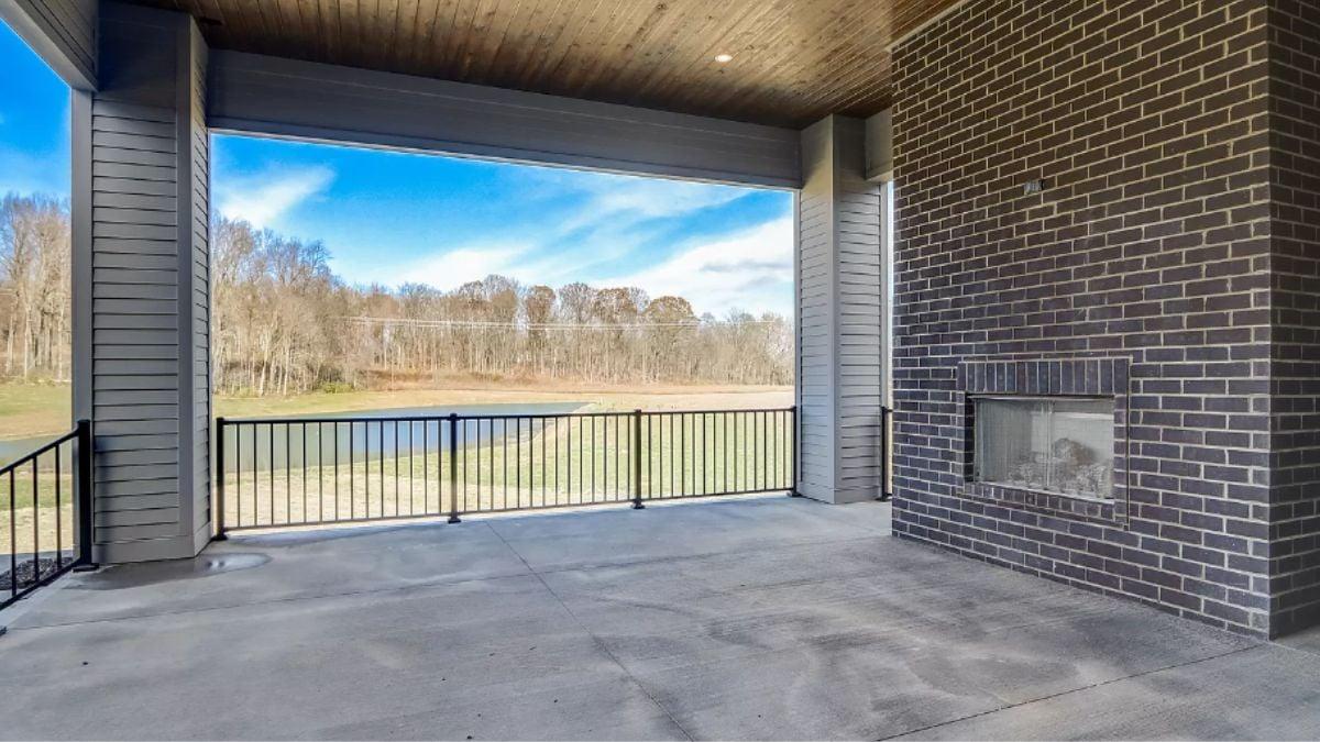 Expansive Patio with Panoramic Views and a Unique Brick Fireplace