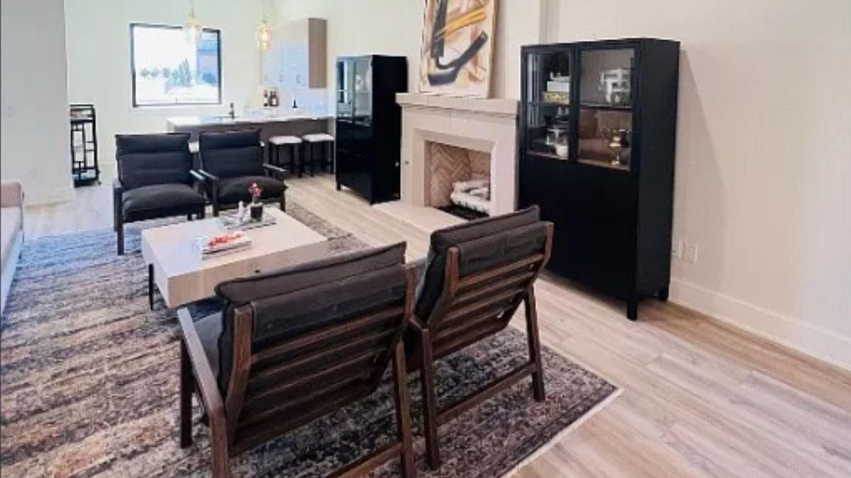Distinctive Living and Dining Area Featuring a Bold Artwork and Black Cabinets