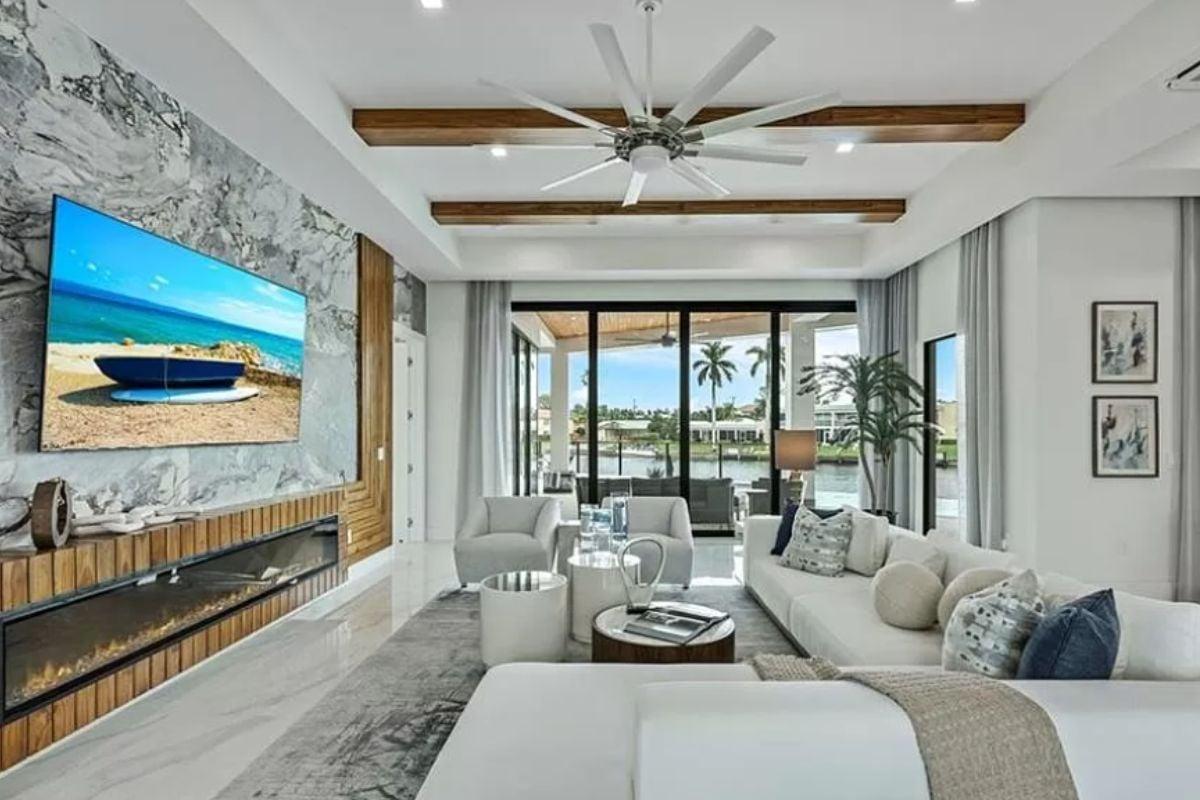 Those Marble Walls and Wood Accents Really Make This Living Room Pop