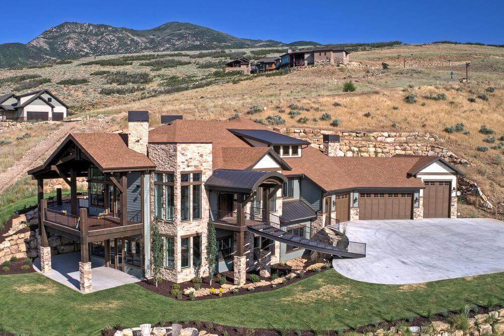 4-Bedroom Ranch for a Sloped Lot with Wet Bar and Angled 4-Car Garage (Floor Plan)