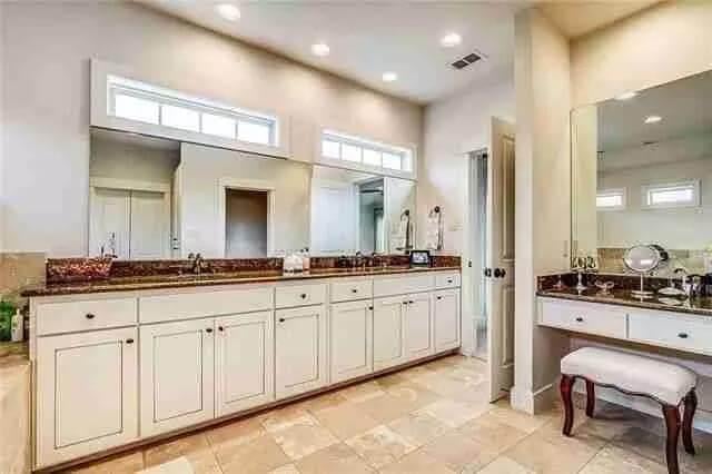 Admire the Dual Sinks and Granite Counters in This Elegant Bathroom
