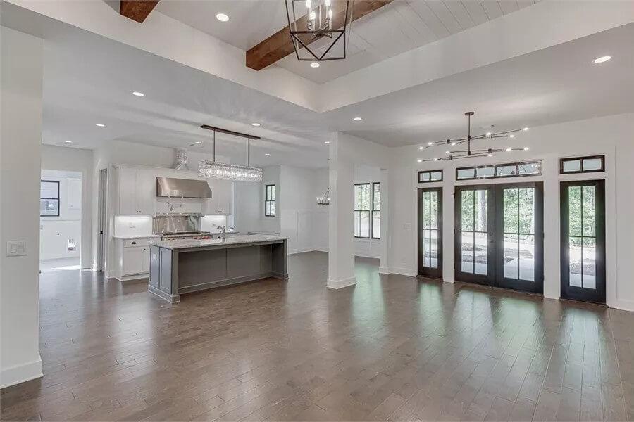Spacious Open-Concept Living Area with Striking Beamed Ceiling