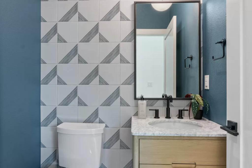 Check Out the Graphic Tile in This Stylish Powder Room