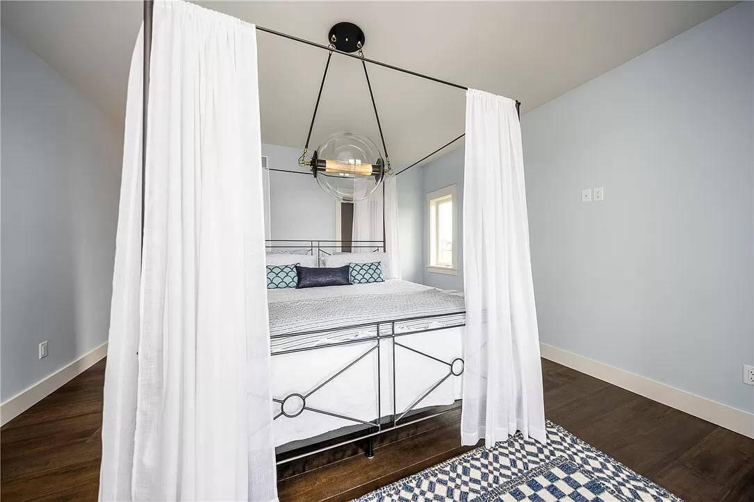 Look at the Classic Canopy Bed Adding Elegance to This Minimalist Bedroom