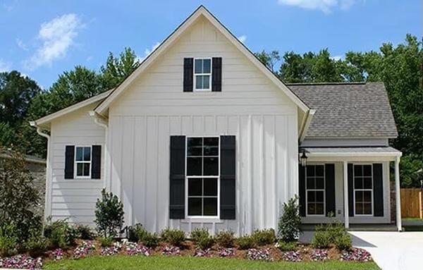 Classic Farmhouse Charm with Striking Black Shutters