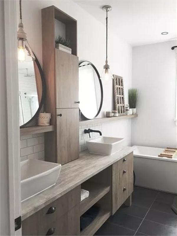 Vaulted Ceilings and Round Mirrors Bring Out the Best in This Dual Vanity Bathroom