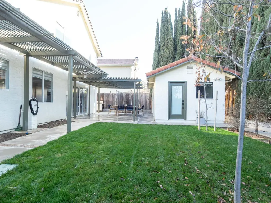 Contemporary 4-Bedroom Mediterranean-Style Home with Covered Patio and 3-Car Garage (2,561 Sq. Ft. Floor Plan)