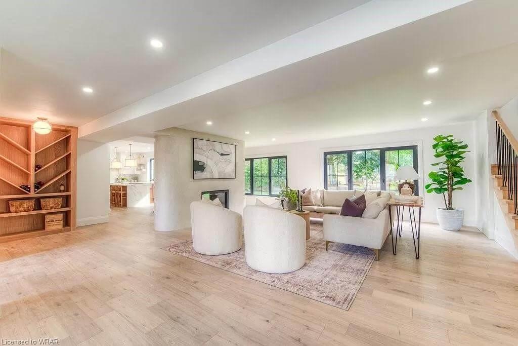 Open Living Room Featuring a Unique Built-in Wine Display