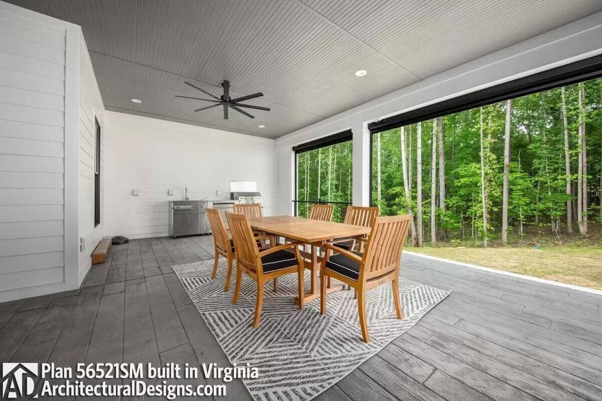 Serene Outdoor Retreat with a Ceiling Fan and Grill Station