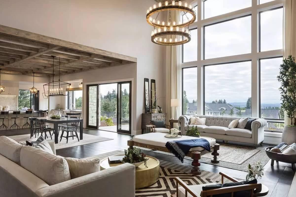 Expansive Living Area with Floor-to-Ceiling Windows and Wooden Ceiling Details