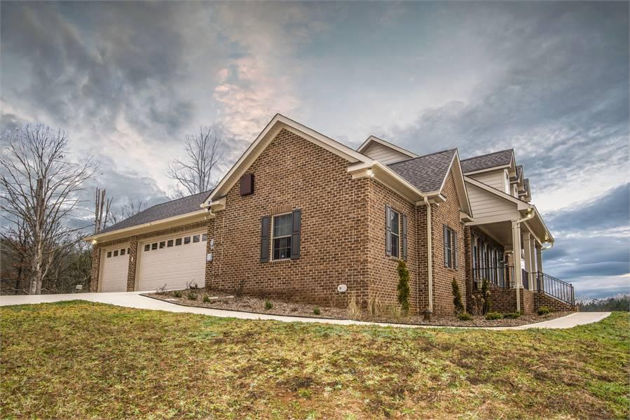 Take in the Brick Exterior and Classic Porch of This Inviting Home