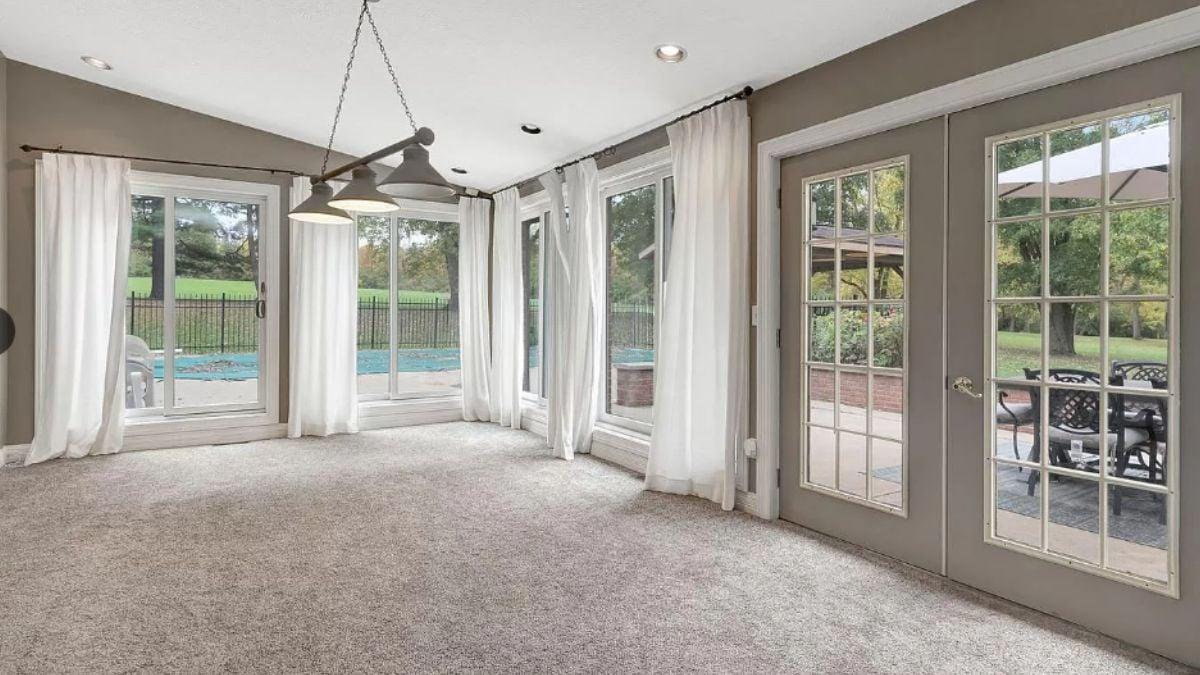 Embrace the Light: Sunlit Room with Poolside Views