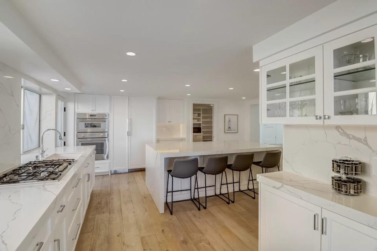 Sleek Kitchen with an Expansive Marble Countertop