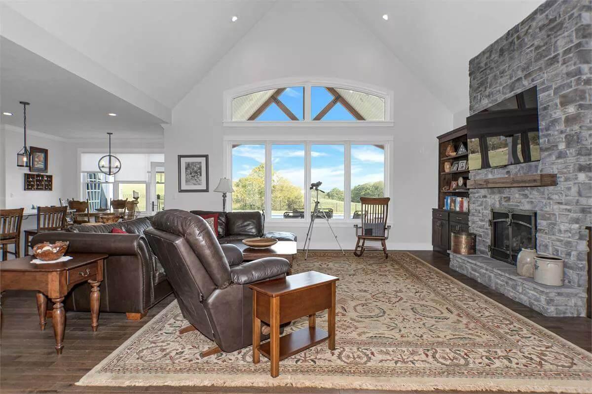 Wow, That Floor-to-Ceiling Stone Fireplace Steals the Show