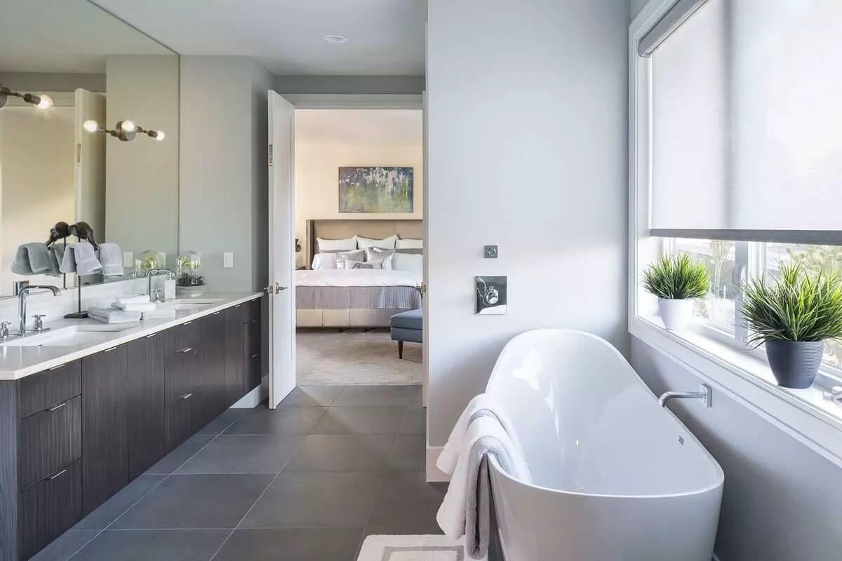 Modern Bathroom Retreat With Freestanding Tub and Serene Views