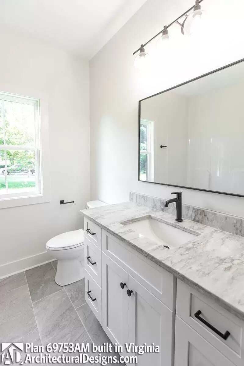 Simplicity Shines: Minimalist Bathroom with Elegant Marble Vanity