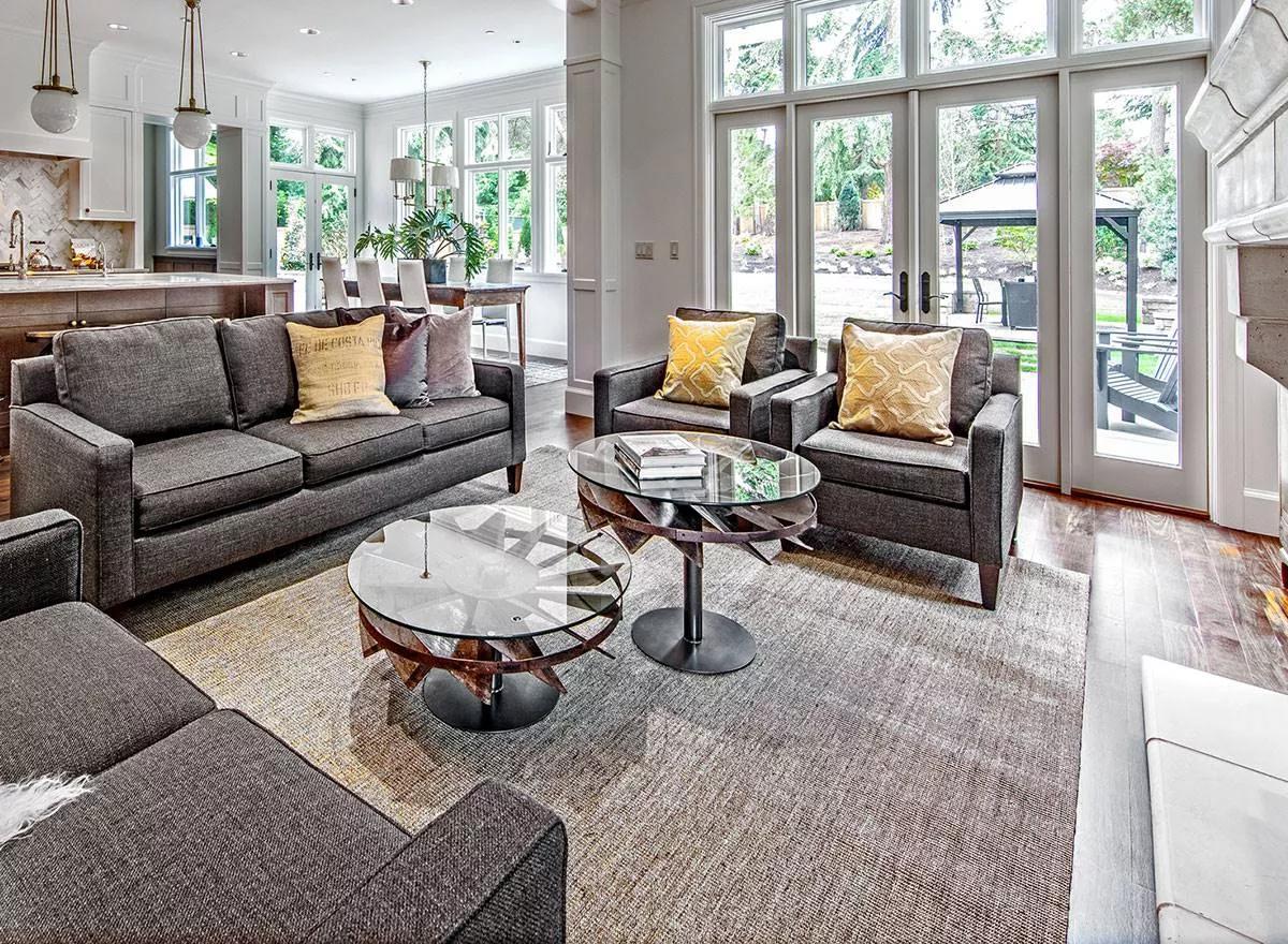 Modern Living Room Design Highlighting Glass Top Tables
