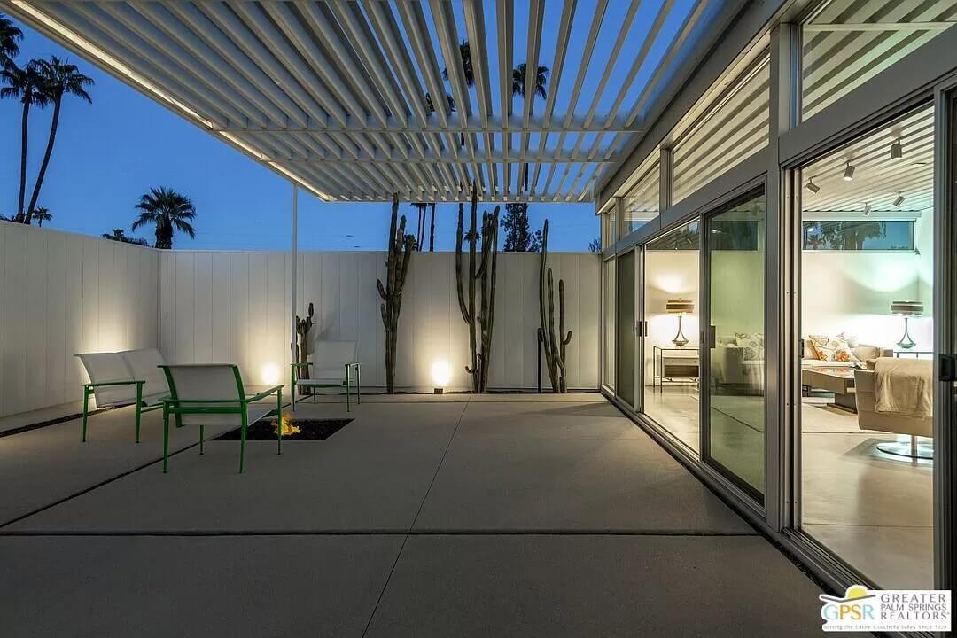 Modern Patio with Dramatic Pergola and Evening Ambiance