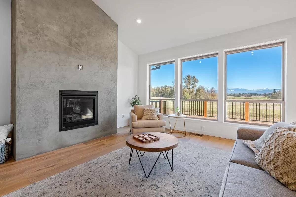 Check Out the Minimalist Concrete Fireplace in This Living Room