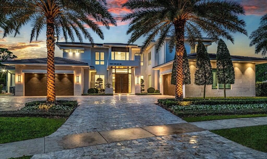 Check Out the Dramatic Entryway with its Towering Palm Trees