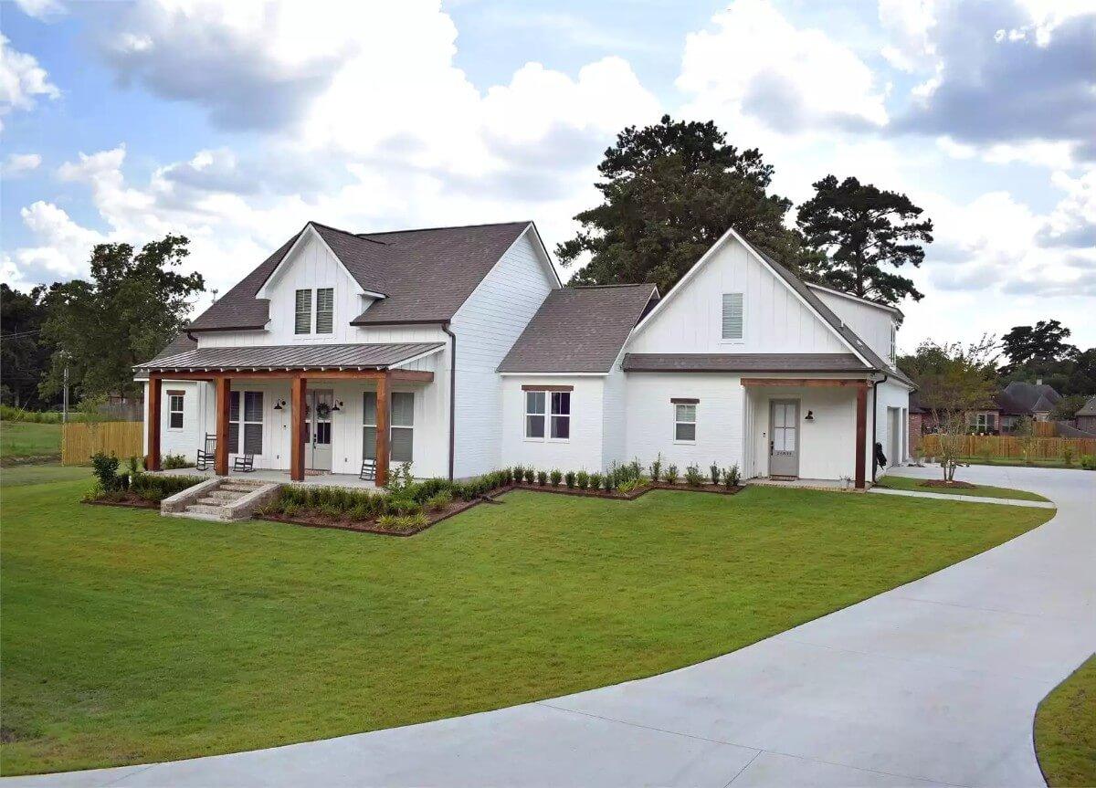 Farmhouse-Style Facade with Striking Wooden Accents and a Cozy Porch