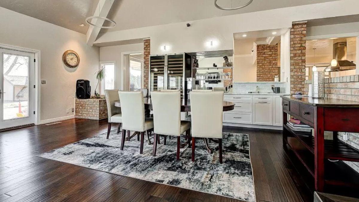 Take a Look at the Elegant Wine Storage in This Brick-Accented Dining Room