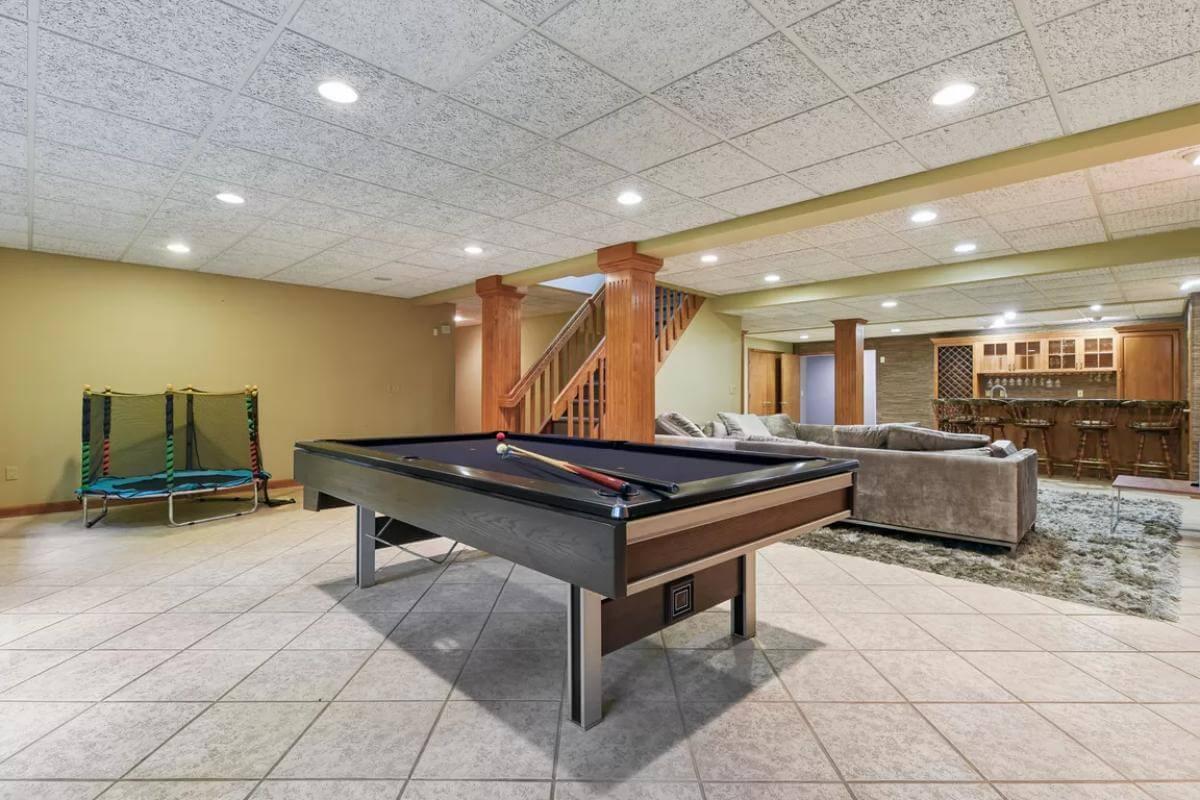 The Ultimate Basement Hangout with a Pool Table and Wet Bar