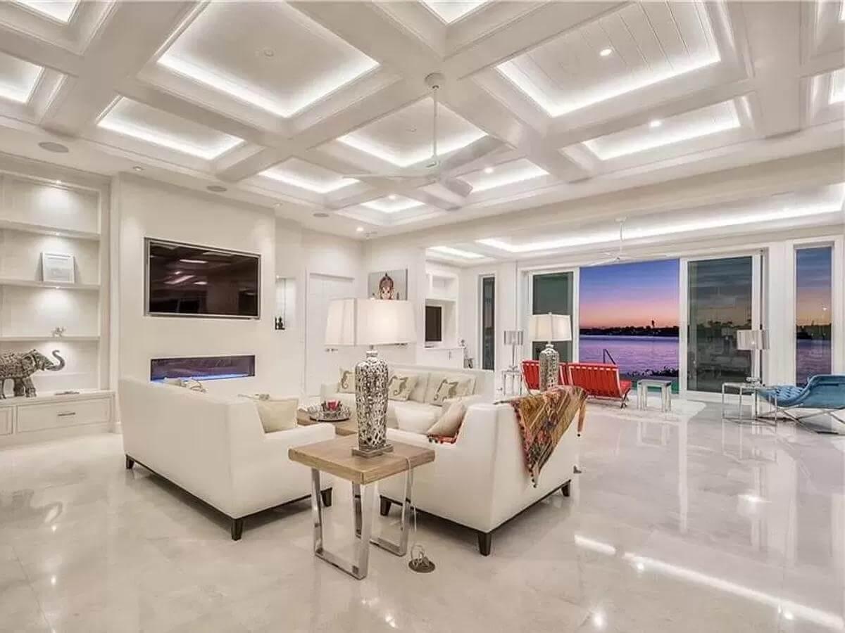 Stunning Living Room with Coffered Ceiling and Waterfront View