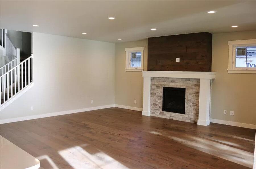 Living Room with a Modern Fireplace and Rustic Wood Accent