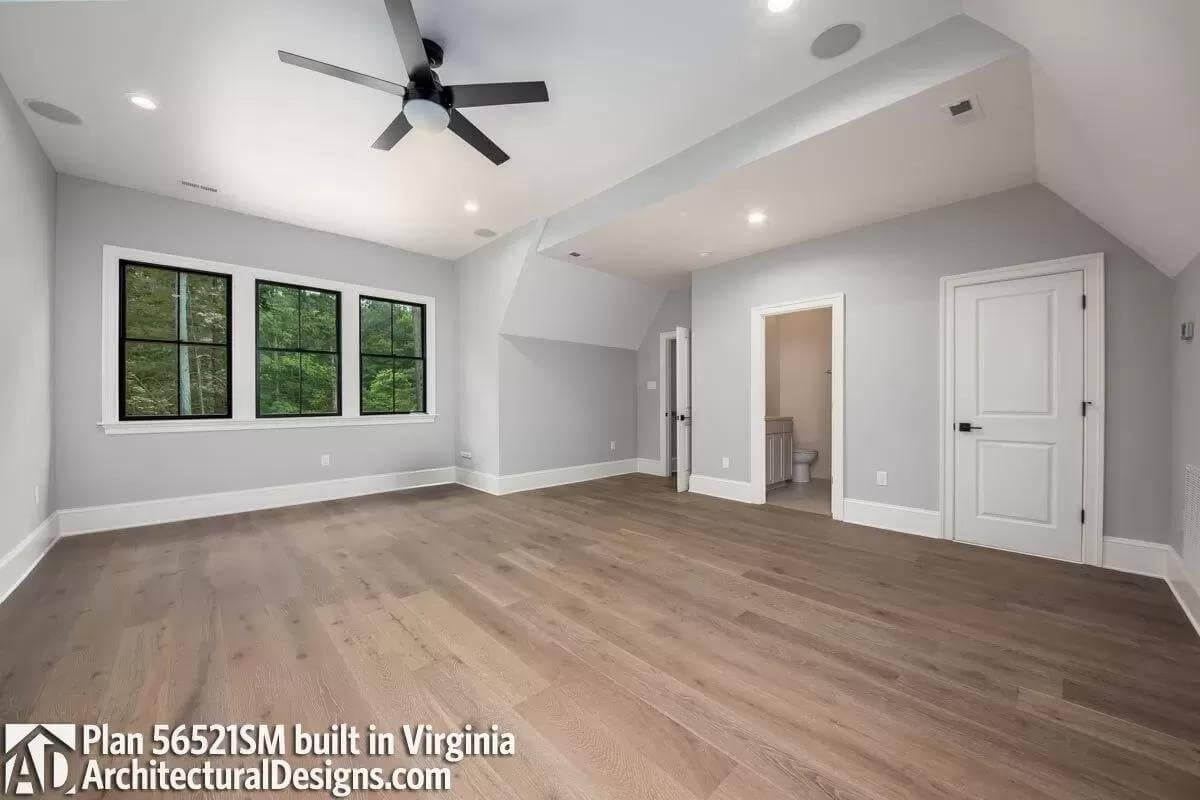 Expansive Bonus Room with Modern Black-Framed Windows