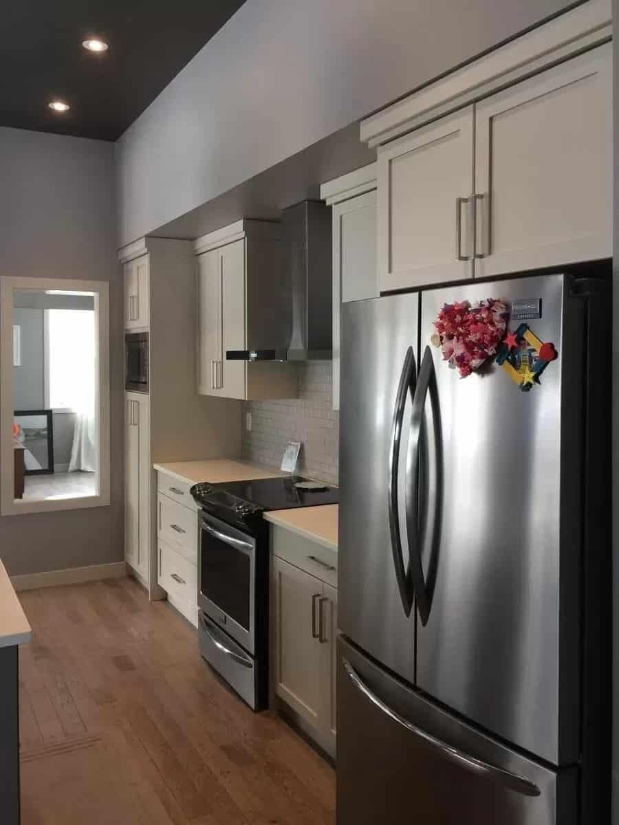 Take a Peek at This Contemporary Galley Kitchen with Streamlined Cabinets