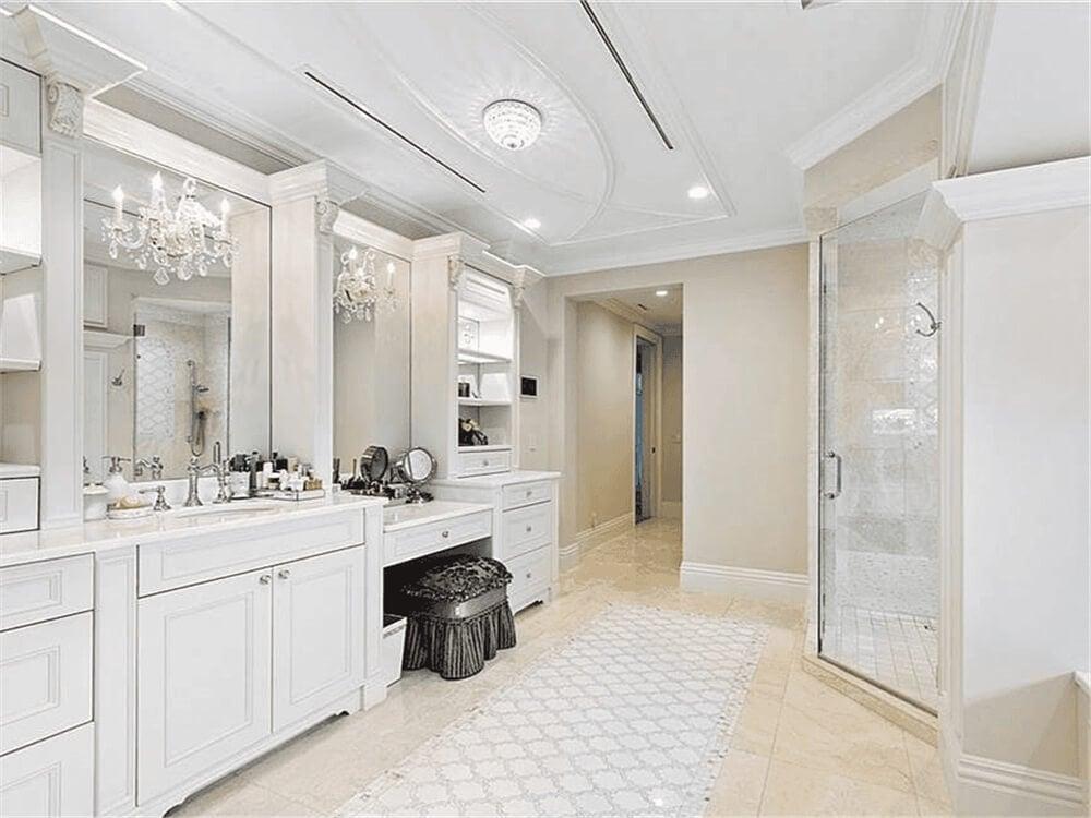 Elegant Bathroom with Dual Vanities and Crystal Chandeliers