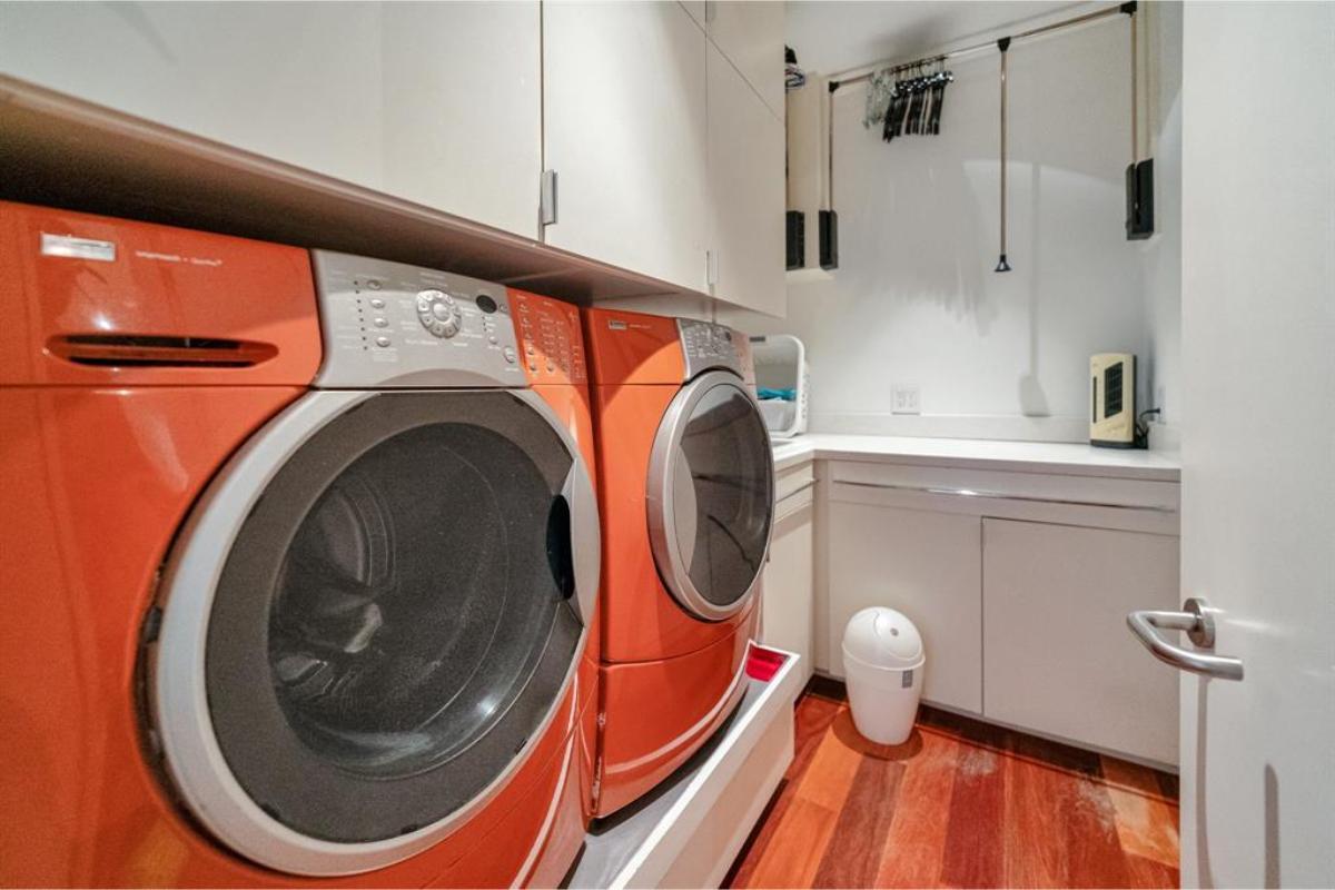 Bold Red Appliances Make a Statement in This Efficient Laundry Room