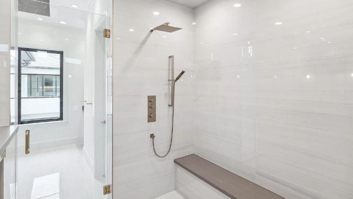 Spot the Elegant Shower Bench and Sleek Fixtures in This Modern Bath