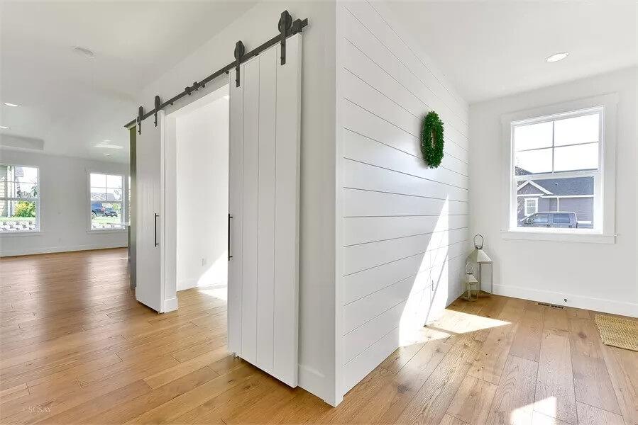 Check Out the Sleek Barn Doors and Shiplap Accents