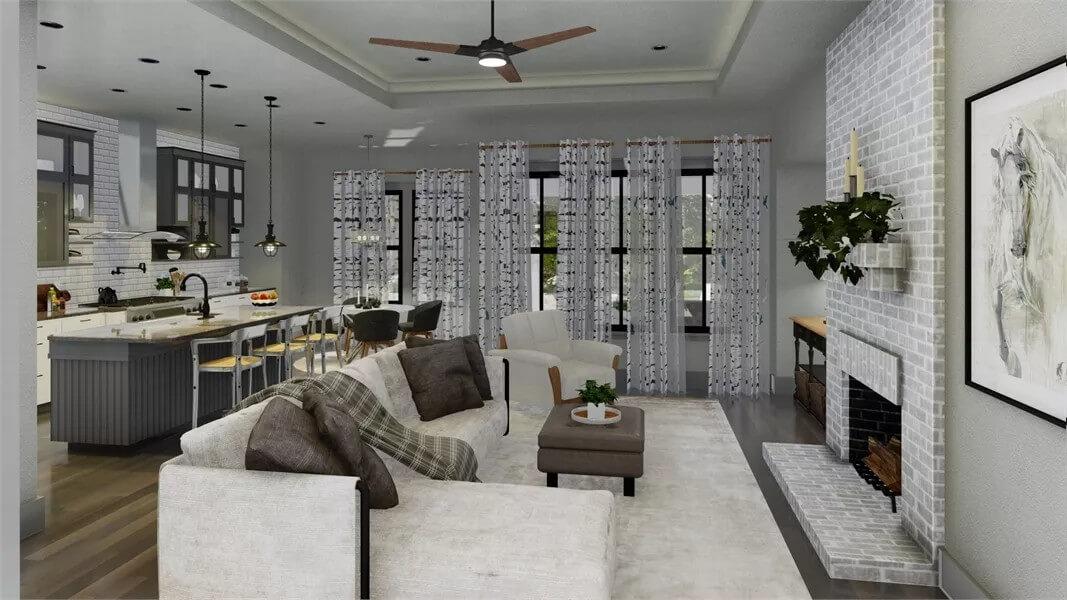 Cozy Living Room Featuring a Brick Fireplace and Open Concept Kitchen