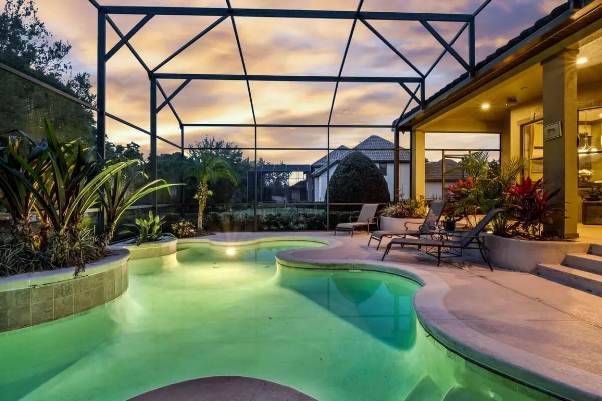 Wow, Notice the Custom Lighting in This Screened-In Pool Area