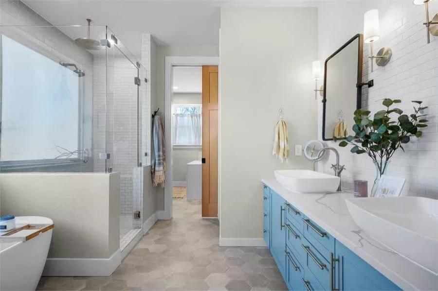 The Cool Blue Cabinetry Pops in This Refreshing Bathroom