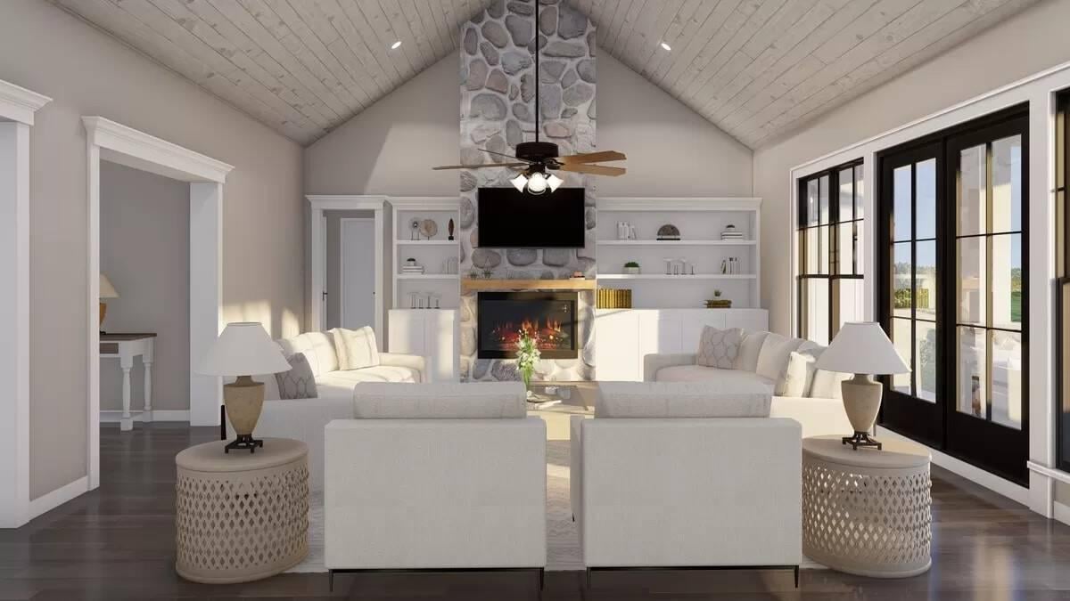 High Ceilings and a Stone Fireplace Elevate This Cozy Living Space