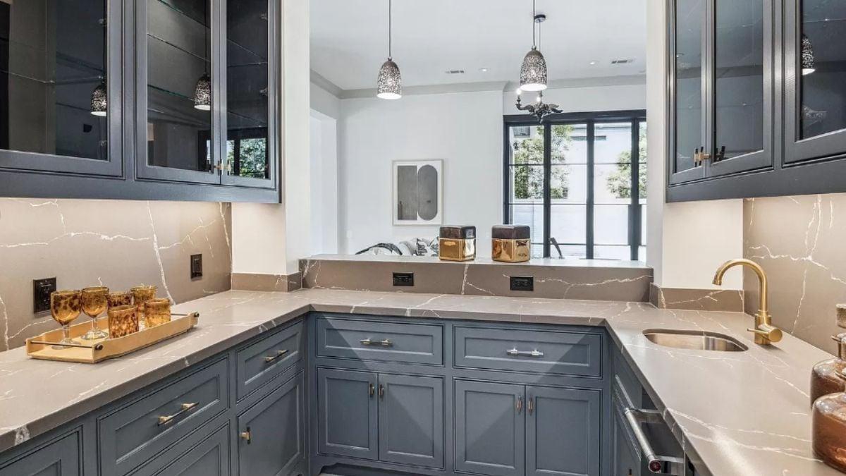 Look at These Sleek Blue Cabinets and Quartz Countertops in the Butler’s Pantry