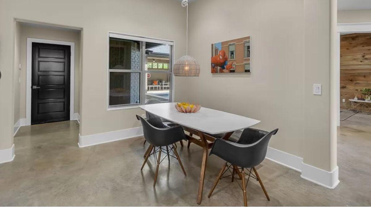 Minimalist Dining Nook with a Bold Black Door