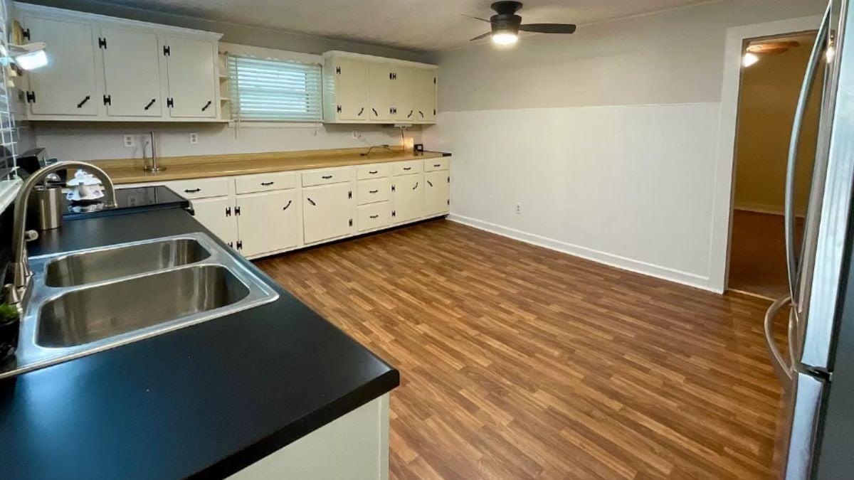 Discover the Retro Black Handles in This Spacious Kitchen