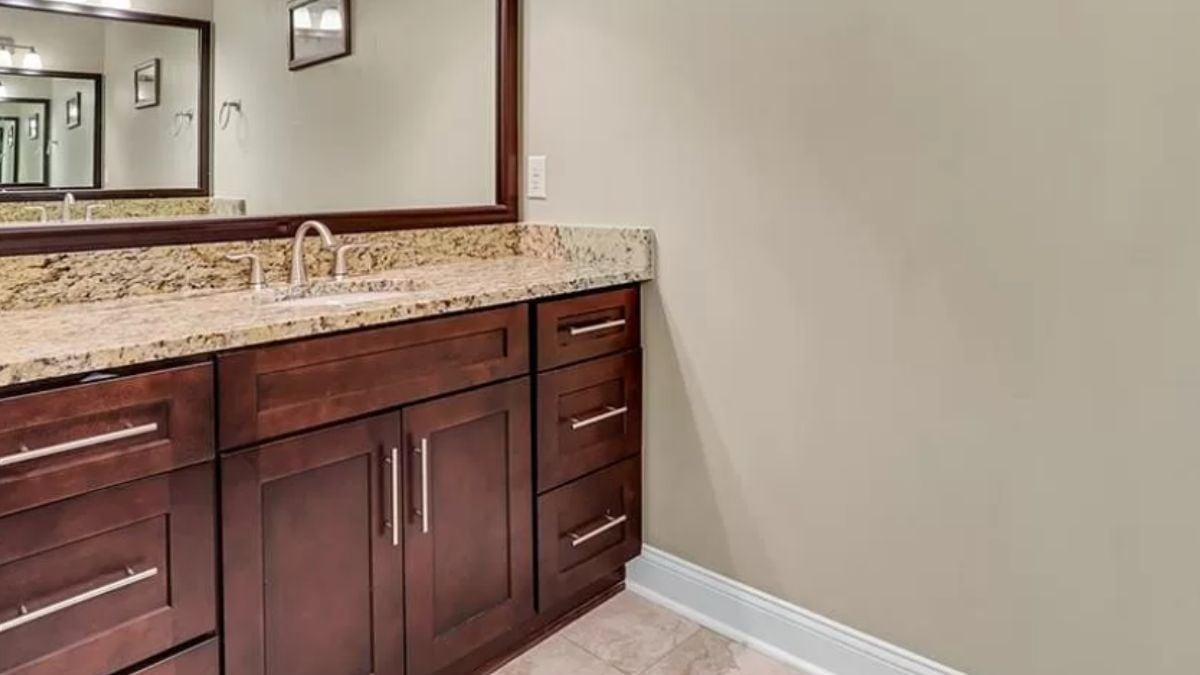 Rich Wood Cabinetry Meets Granite Elegance in This Thoughtful Vanity Design