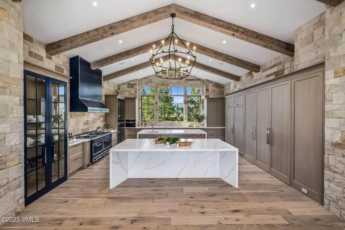 Notice the Robust Wooden Beams and Dual Islands in This Kitchen